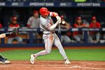 Apr 21, 2026; St. Petersburg, Florida, USA; Cincinnati Reds infielder Matt McLain (9) hits during the seventh inning against Tampa Bay Rays at Tropicana Field. Mandatory Credit: Pablo Robles-Imagn Images