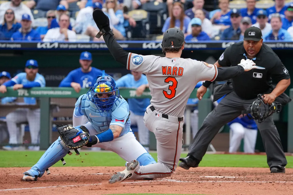 Apr 22, 2026; Kansas City, Missouri, USA; Baltimore Orioles designated hitter Taylor Ward (3) is tagged out at home by Kansas City Royals catcher Carter Jensen (22) during the ninth inning at Kauffman Stadium. Mandatory Credit: Denny Medley-Imagn Images