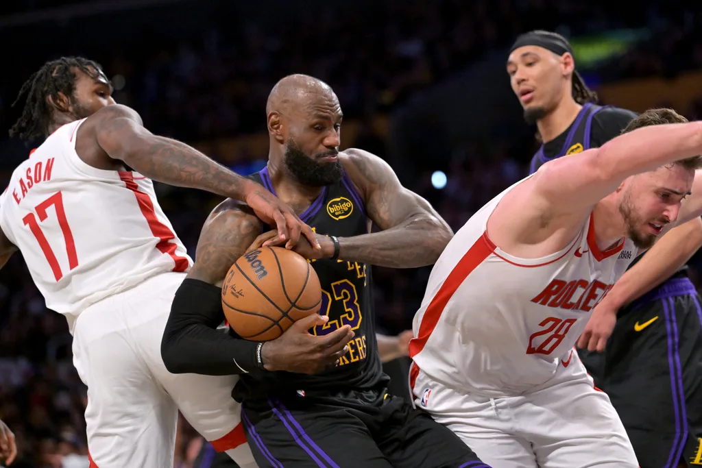Apr 21, 2026; Los Angeles, California, USA; Houston Rockets forward Tari Eason (17), center Alperen Sengun (28) and Los Angeles Lakers forward LeBron James (23) battle for a rebound during the second half of game two of the first round of the 2026 NBA Playoffs at Crypto.com Arena. Mandatory Credit: Jayne Kamin-Oncea-Imagn Images