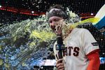 Apr 22, 2026; San Francisco, California, USA;  San Francisco Giants catcher Patrick Bailey (14) gets splashed after defeating the Los Angeles Dodgers at Oracle Park. Mandatory Credit: Stan Szeto-Imagn Images
