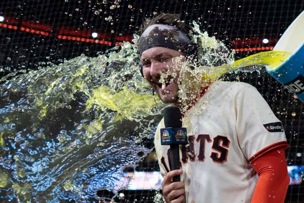 Apr 22, 2026; San Francisco, California, USA; San Francisco Giants catcher Patrick Bailey (14) gets splashed after defeating the Los Angeles Dodgers at Oracle Park. Mandatory Credit: Stan Szeto-Imagn Images