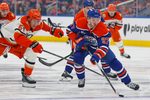 Apr 22, 2026; Edmonton, Alberta, CAN; Anaheim Ducks forward Cutter Gauthier (61) tries to knock the puck away from Edmonton Oilers forward Connor McDavid (97) during the first period in game two of the first round of the 2026 Stanley Cup Playoffs at Rogers Place. Mandatory Credit: Perry Nelson-Imagn Images