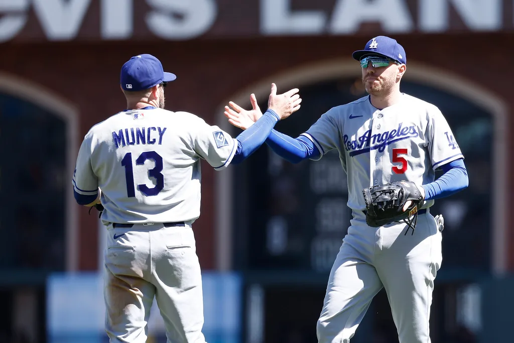 Apr 23, 2026; San Francisco, California, USA; Los Angeles Dodgers third baseman Max Muncy (13) celebrates with first baseman Freddie Freeman (5) after the game against the San Francisco Giants at Oracle Park. Mandatory Credit: Kelley L Cox-Imagn Images