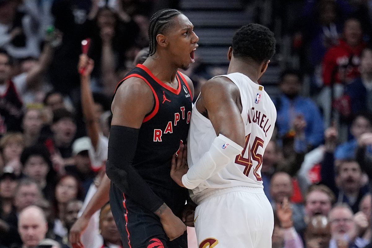 Apr 23, 2026; Toronto, Ontario, CAN; Toronto Raptors forward RJ Barrett (9) celebrates as Cleveland Cavaliers guard Donovan Mitchell (45) tries to walk away during the second half of game three of the first round of the 2026 NBA Playoffs at Scotiabank Arena. Mandatory Credit: John E. Sokolowski-Imagn Images
