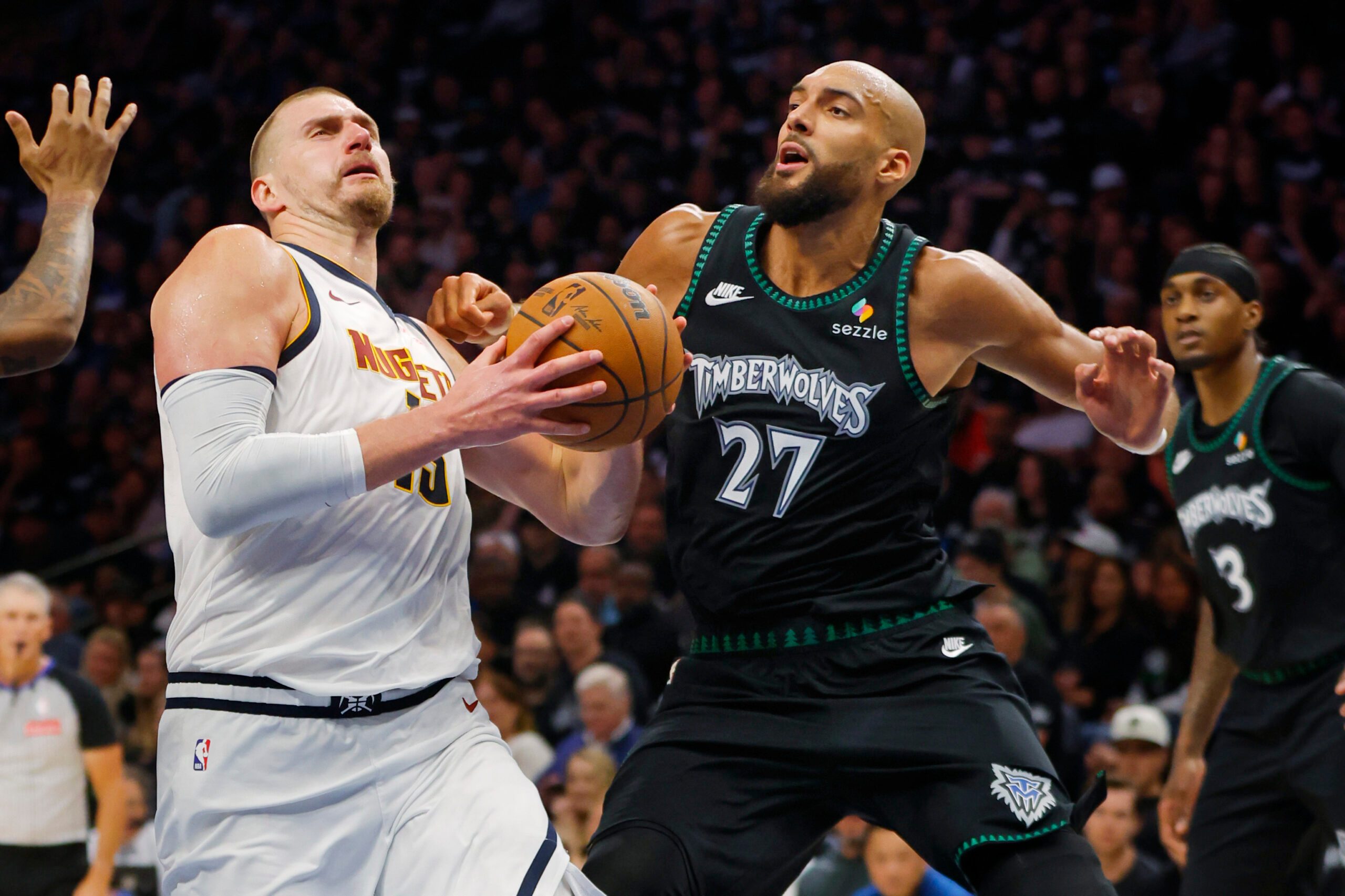 Apr 23, 2026; Minneapolis, Minnesota, USA; Denver Nuggets center Nikola Jokic (15) goes to the basket against Minnesota Timberwolves center Rudy Gobert (27) in the third quarter at Target Center. Mandatory Credit: Bruce Kluckhohn-Imagn Images