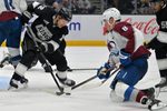Apr 23, 2026; Los Angeles, California, USA; Los Angeles Kings left wing Trevor Moore (12) defends Colorado Avalanche defenseman Cale Makar (8) in game three of the first round of the 2026 Stanley Cup Playoffs at Crypto.com Arena. Mandatory Credit: Jayne Kamin-Oncea-Imagn Images