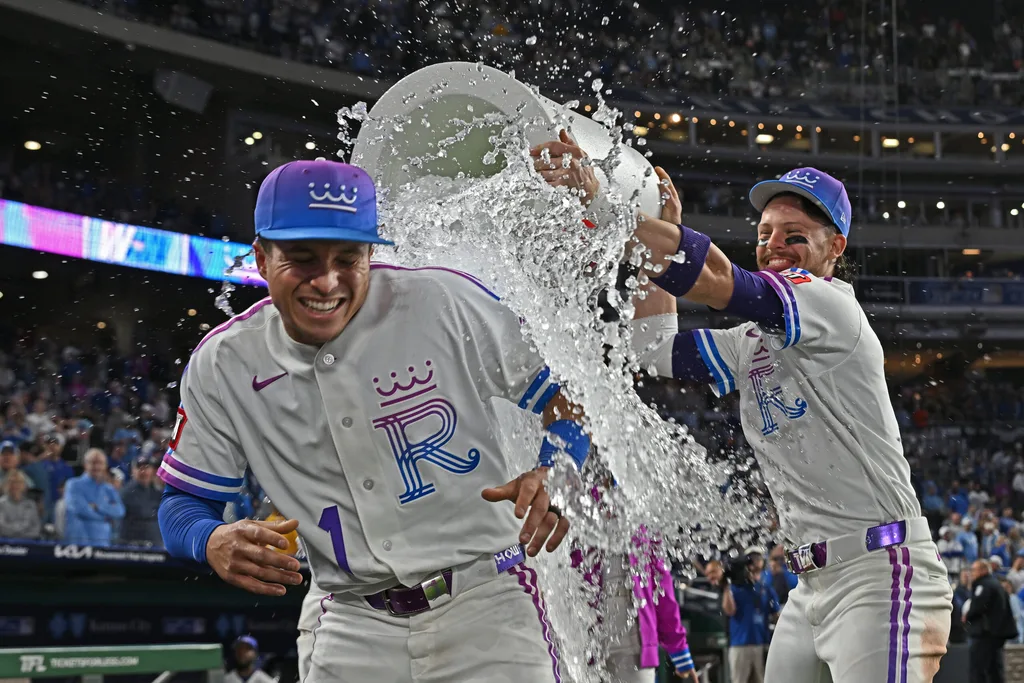 Apr 24, 2026; Kansas City, Missouri, USA; Kansas City Royals shortstop Bobby Witt Jr. (7) douses left fielder Isaac Collins (1) with ice water after beating the Los Angeles Angels at Kauffman Stadium. Mandatory Credit: Peter Aiken-Imagn Images