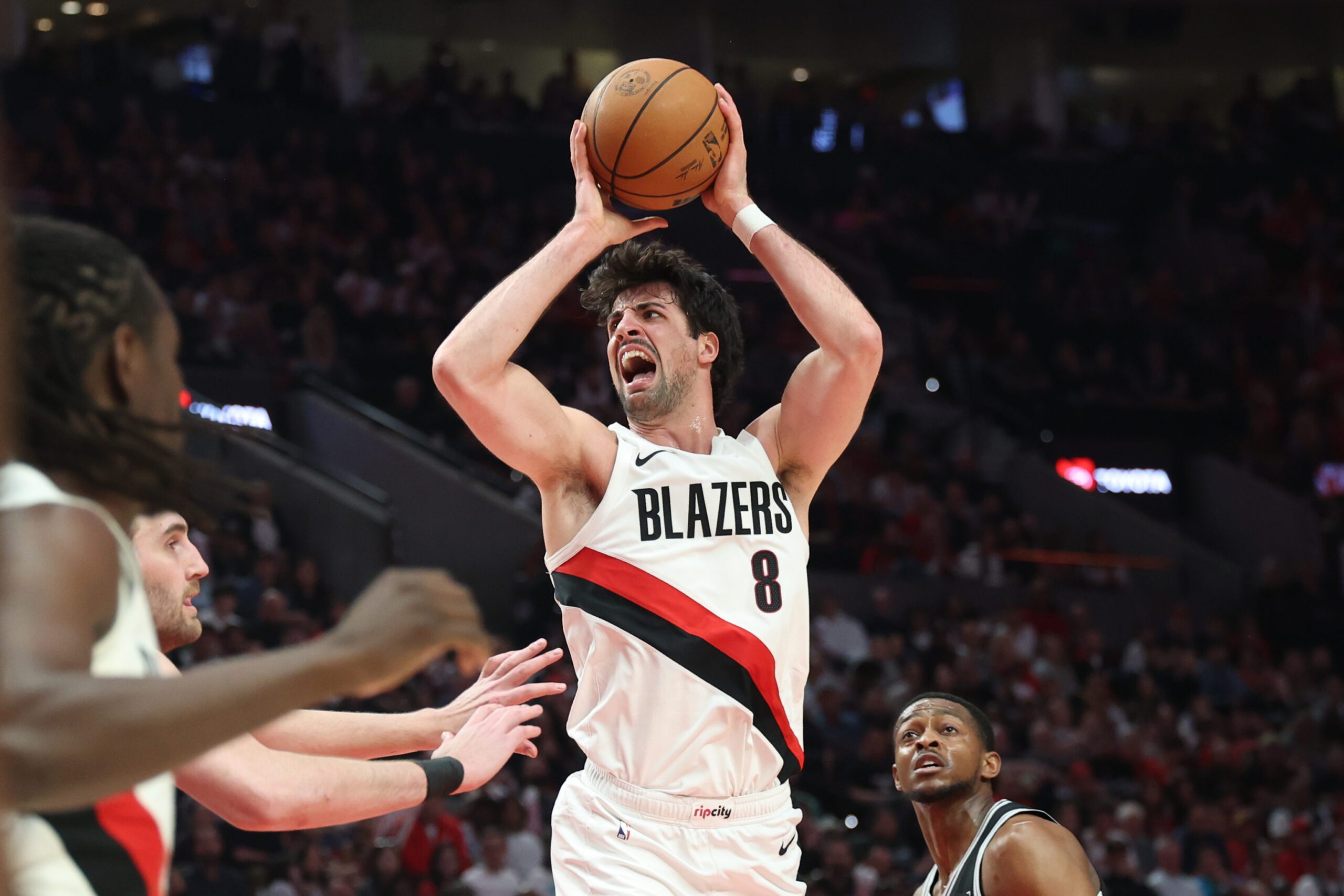 Apr 24, 2026; Portland, Oregon, USA; Portland Trail Blazers forward Deni Avdija (8) reacts after drawing a foul on San Antonio Spurs guard De'aaron Fox (4) during the first half during game three of the first round of the 2026 NBA Playoffs at Moda Center. Mandatory Credit: Jaime Valdez-Imagn Images