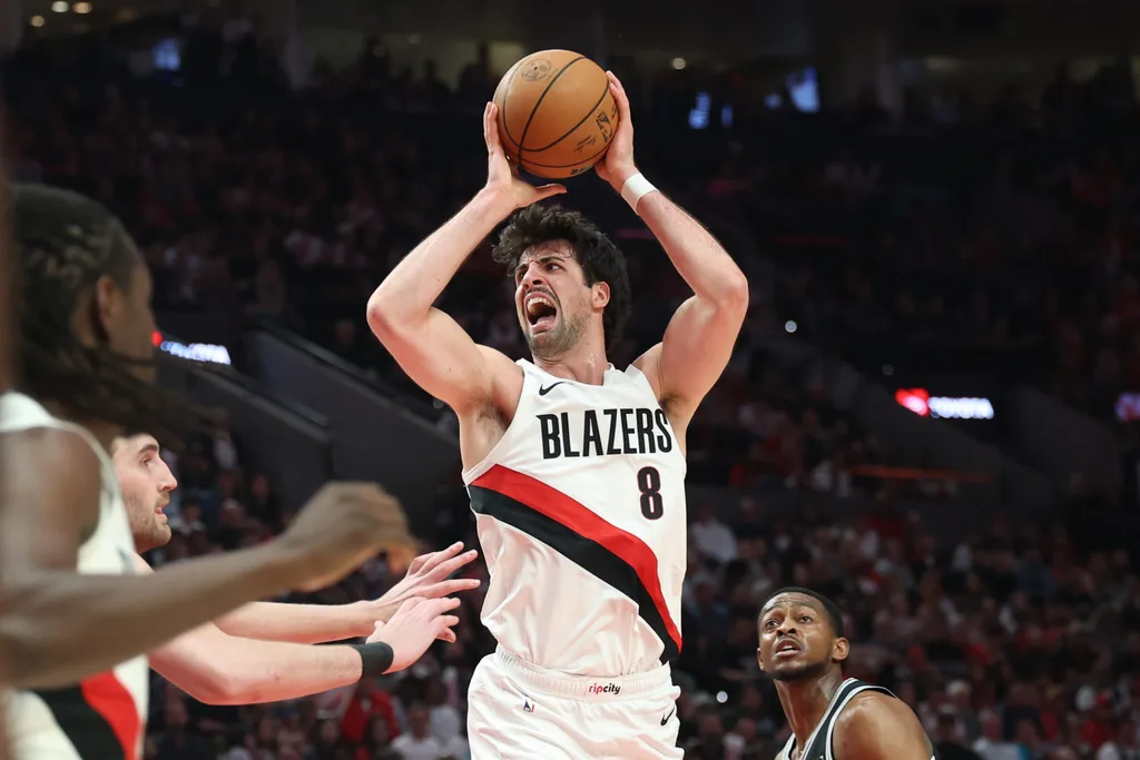 Apr 24, 2026; Portland, Oregon, USA; Portland Trail Blazers forward Deni Avdija (8) reacts after drawing a foul on San Antonio Spurs guard De'aaron Fox (4) during the first half during game three of the first round of the 2026 NBA Playoffs at Moda Center. Mandatory Credit: Jaime Valdez-Imagn Images