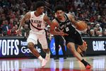 Apr 24, 2026; Portland, Oregon, USA; San Antonio Spurs guard Dylan Harper (2) drives to the basket past Portland Trail Blazers guard Scoot Henderson (00) during the second half during game three of the first round of the 2026 NBA Playoffs at Moda Center. Mandatory Credit: Jaime Valdez-Imagn Images
