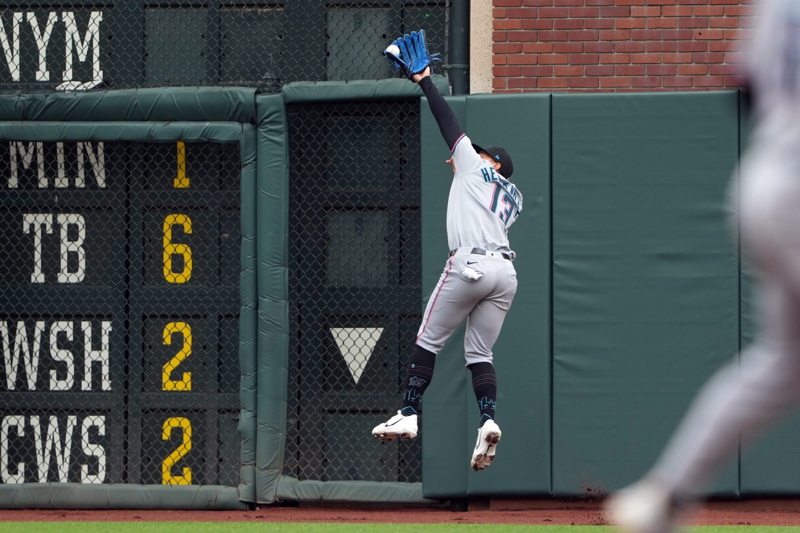 Apr 25, 2026; San Francisco, California, USA; Miami Marlins right fielder Heriberto Hernandez (13) catches a fly ball against the San Francisco Giants during the eighth inning at Oracle Park. Mandatory Credit: Darren Yamashita-Imagn Images