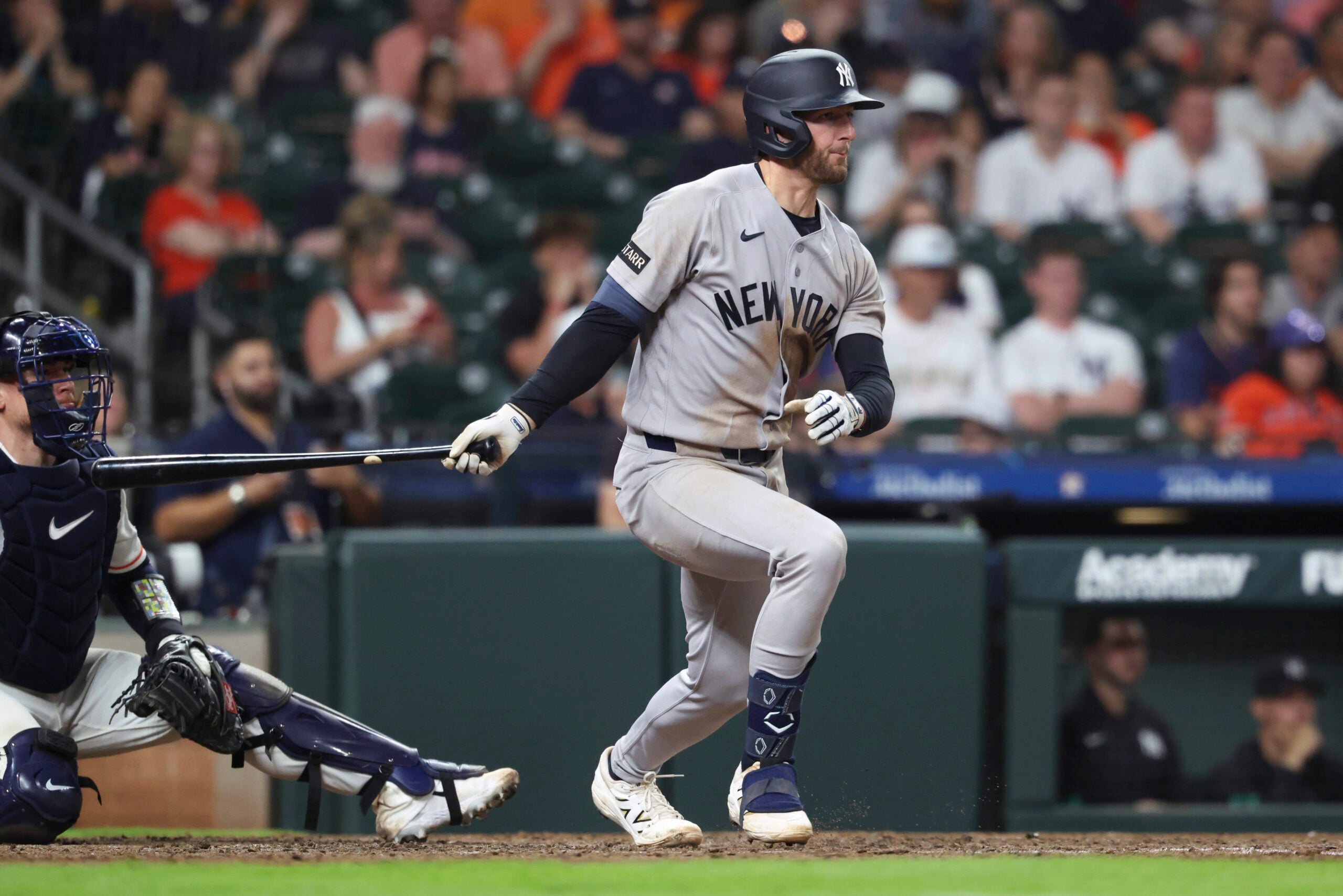 Apr 25, 2026; Houston, Texas, USA; New York Yankees third baseman Ryan McMahon (19) hits an RBI single during the ninth inning against the Houston Astros at Daikin Park. Mandatory Credit: Troy Taormina-Imagn Images