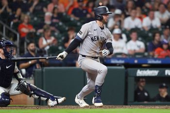 Apr 25, 2026; Houston, Texas, USA; New York Yankees third baseman Ryan McMahon (19) hits an RBI single during the ninth inning against the Houston Astros at Daikin Park. Mandatory Credit: Troy Taormina-Imagn Images