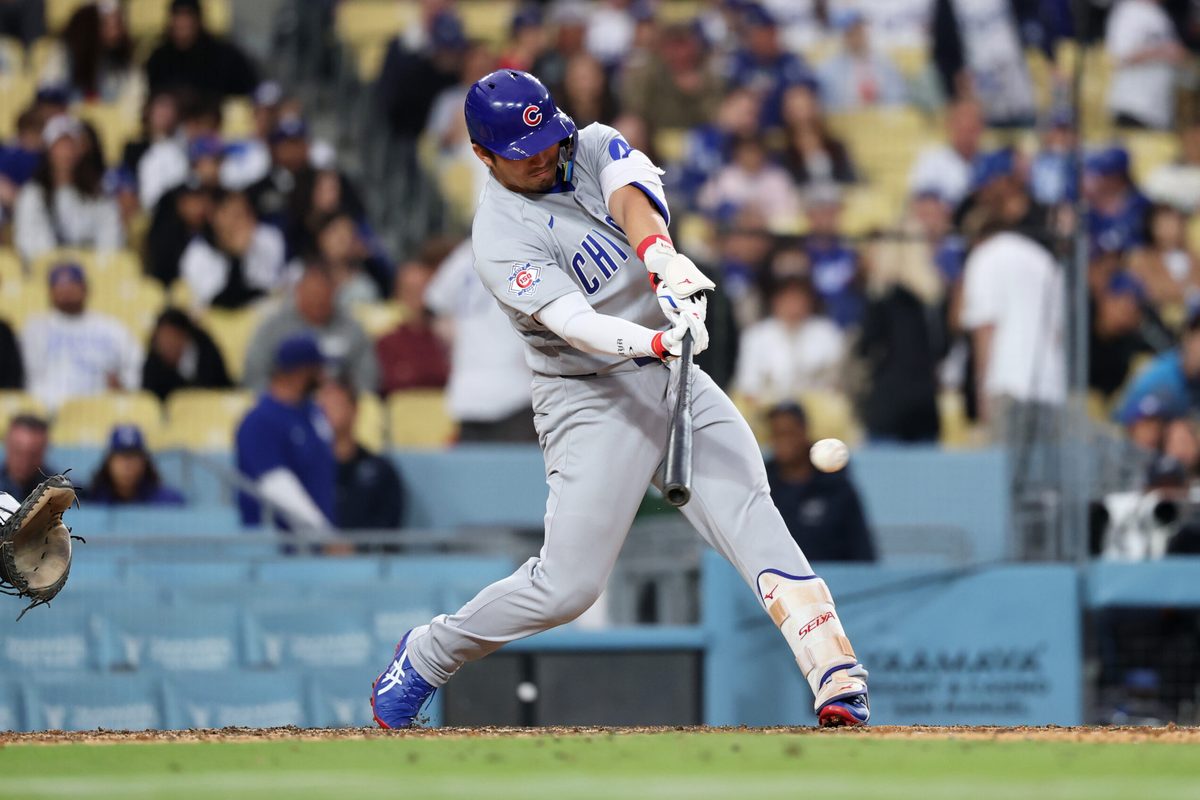 Apr 25, 2026; Los Angeles, California, USA; Chicago Cubs outfielder Seiya Suzuki (27) hits a single against the Los Angeles Dodgers during the eighth inning at Dodger Stadium. Mandatory Credit: Kiyoshi Mio-Imagn Images