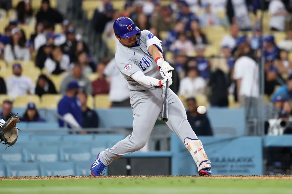 Apr 25, 2026; Los Angeles, California, USA; Chicago Cubs outfielder Seiya Suzuki (27) hits a single against the Los Angeles Dodgers during the eighth inning at Dodger Stadium. Mandatory Credit: Kiyoshi Mio-Imagn Images