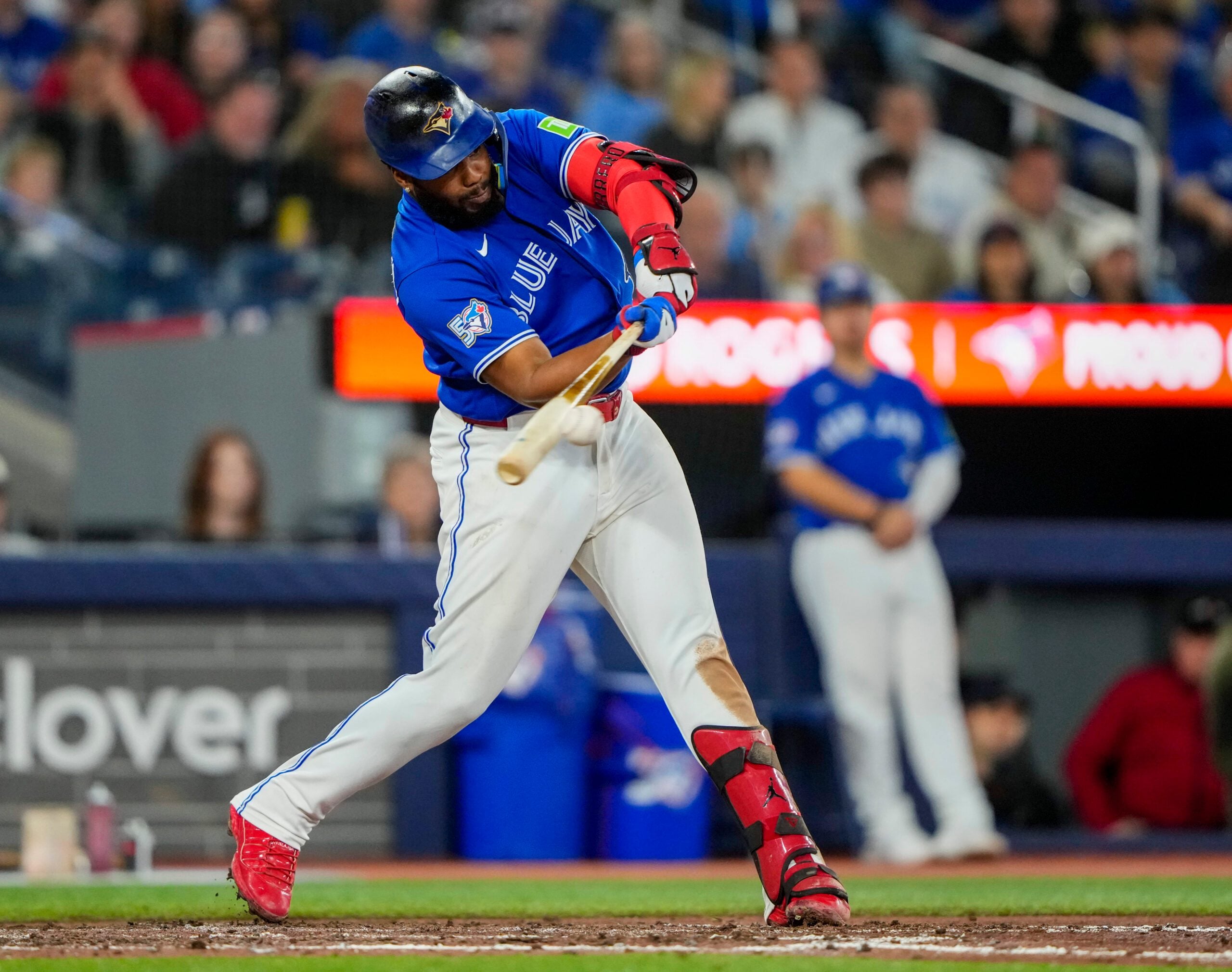 Apr 26, 2026; Toronto, Ontario, CAN; Toronto Blue Jays first baseman Vladimir Guerrero Jr. (27) hits a double during the sixth inning against the Cleveland Guardians at Rogers Centre. Mandatory Credit: Kevin Sousa-Imagn Images