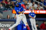 Apr 26, 2026; Toronto, Ontario, CAN; Toronto Blue Jays first baseman Vladimir Guerrero Jr. (27) hits a double during the sixth inning against the Cleveland Guardians at Rogers Centre. Mandatory Credit: Kevin Sousa-Imagn Images