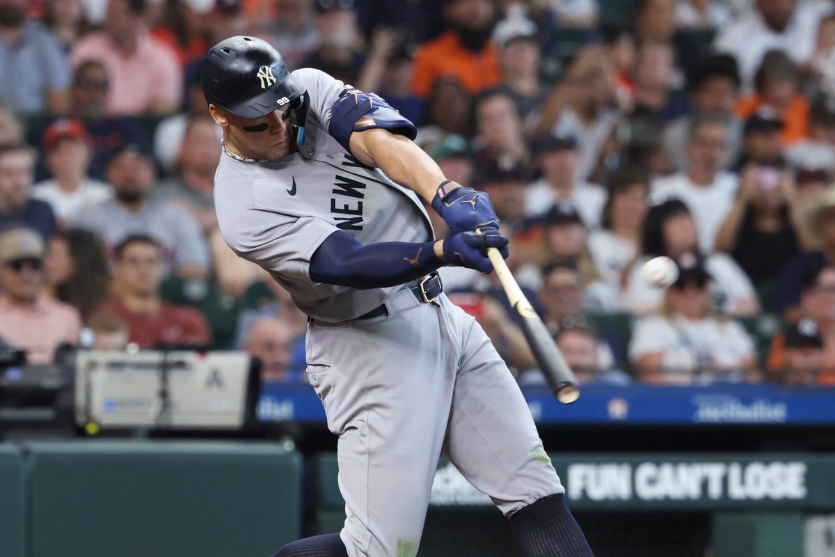Apr 26, 2026; Houston, Texas, USA; New York Yankees right fielder Aaron Judge (99) hits a home run during the sixth inning against the Houston Astros at Daikin Park. Mandatory Credit: Troy Taormina-Imagn Images