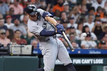 Apr 26, 2026; Houston, Texas, USA; New York Yankees right fielder Aaron Judge (99) hits a home run during the sixth inning against the Houston Astros at Daikin Park. Mandatory Credit: Troy Taormina-Imagn Images
