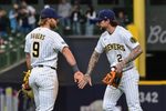 Apr 26, 2026; Milwaukee, Wisconsin, USA; Milwaukee Brewers first baseman Jake Bauers (9) and second baseman Brice Turang (2) celebrates after beating the Pittsburgh Pirates at American Family Field. Mandatory Credit: Benny Sieu-Imagn Images