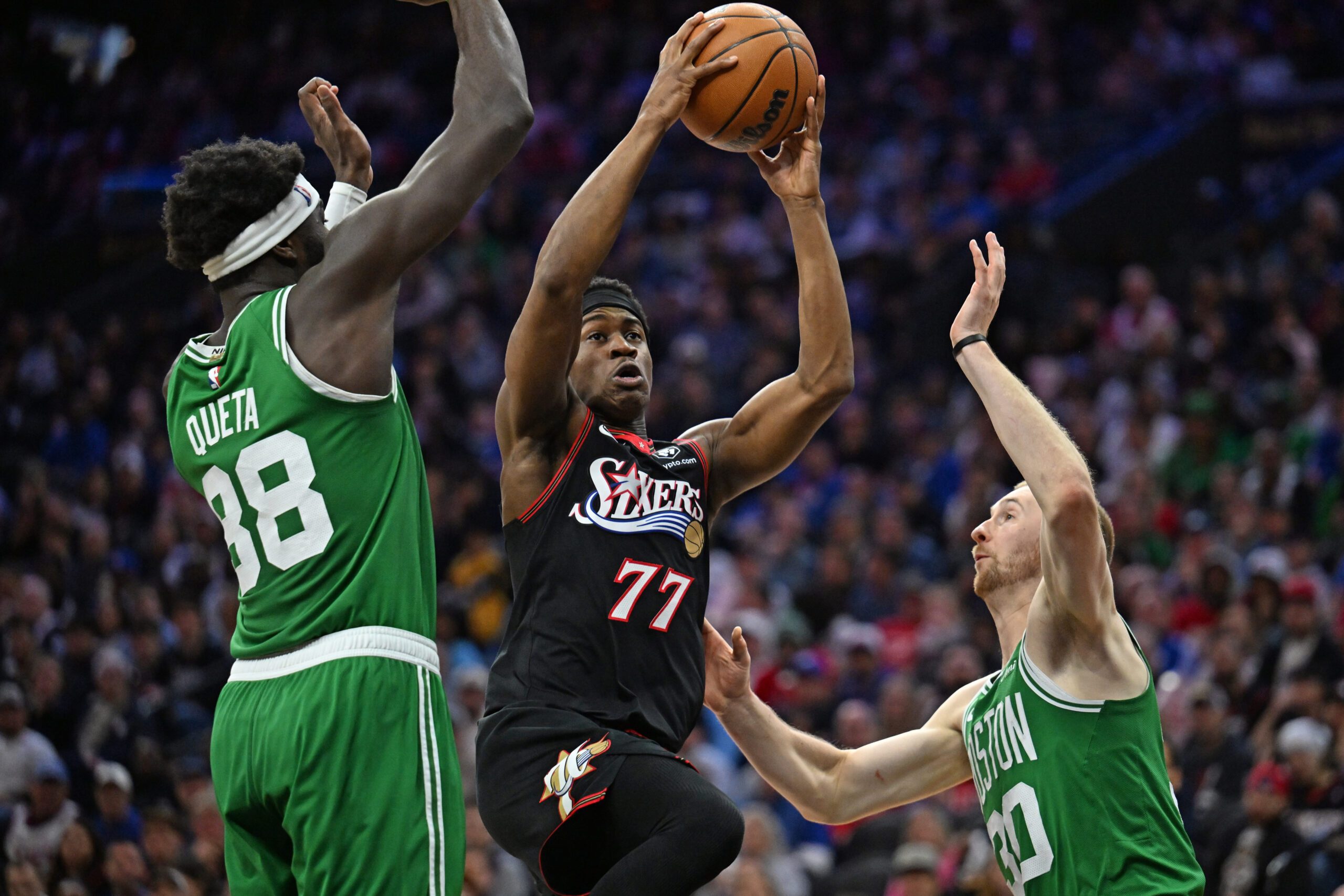 Apr 26, 2026; Philadelphia, Pennsylvania, USA; Philadelphia 76ers guard Vj Edgecombe (77) drives to the basket against Boston Celtics center Neemias Queta (88) and forward Sam Hauser (30) during the second half at Xfinity Mobile Arena. Mandatory Credit: Eric Hartline-Imagn Images