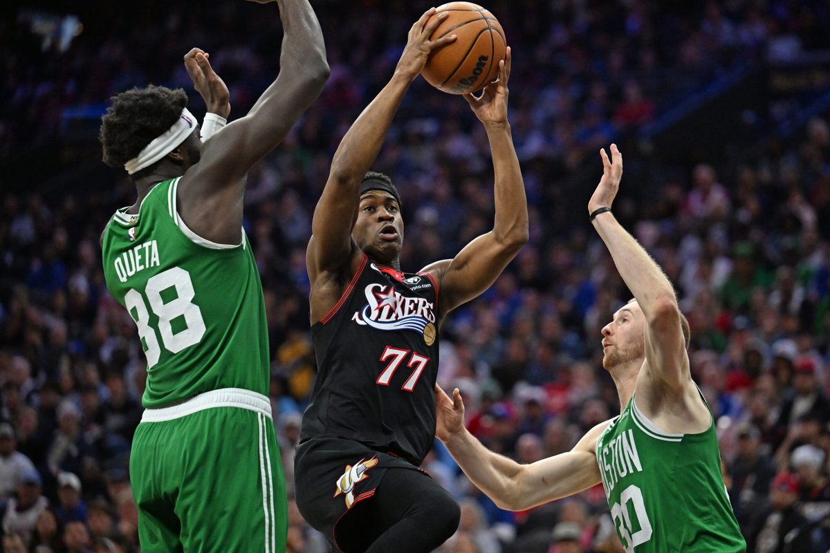 Apr 26, 2026; Philadelphia, Pennsylvania, USA; Philadelphia 76ers guard Vj Edgecombe (77) drives to the basket against Boston Celtics center Neemias Queta (88) and forward Sam Hauser (30) during the second half at Xfinity Mobile Arena. Mandatory Credit: Eric Hartline-Imagn Images