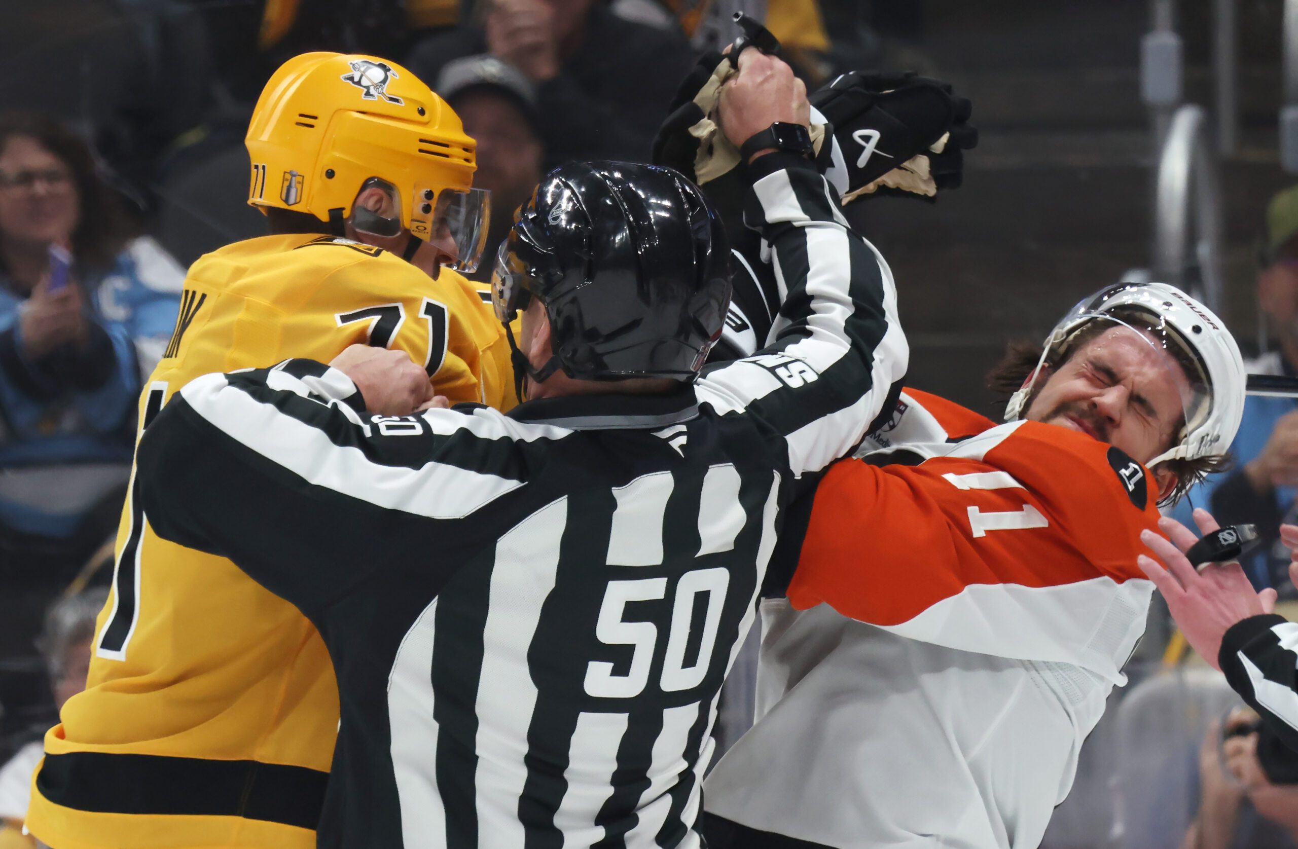 Apr 27, 2026; Pittsburgh, Pennsylvania, USA;  Pittsburgh Penguins center Evgeni Malkin (71) checks Philadelphia Flyers right wing Travis Konecny (11) after the play as linesman Scott Cherrey (50) intervenes during the first period in game five of the first round of the 2026 Stanley Cup Playoffs at PPG Paints Arena. Mandatory Credit: Charles LeClaire-Imagn Images