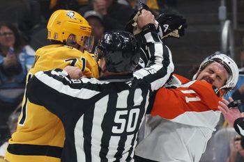 Apr 27, 2026; Pittsburgh, Pennsylvania, USA;  Pittsburgh Penguins center Evgeni Malkin (71) checks Philadelphia Flyers right wing Travis Konecny (11) after the play as linesman Scott Cherrey (50) intervenes during the first period in game five of the first round of the 2026 Stanley Cup Playoffs at PPG Paints Arena. Mandatory Credit: Charles LeClaire-Imagn Images