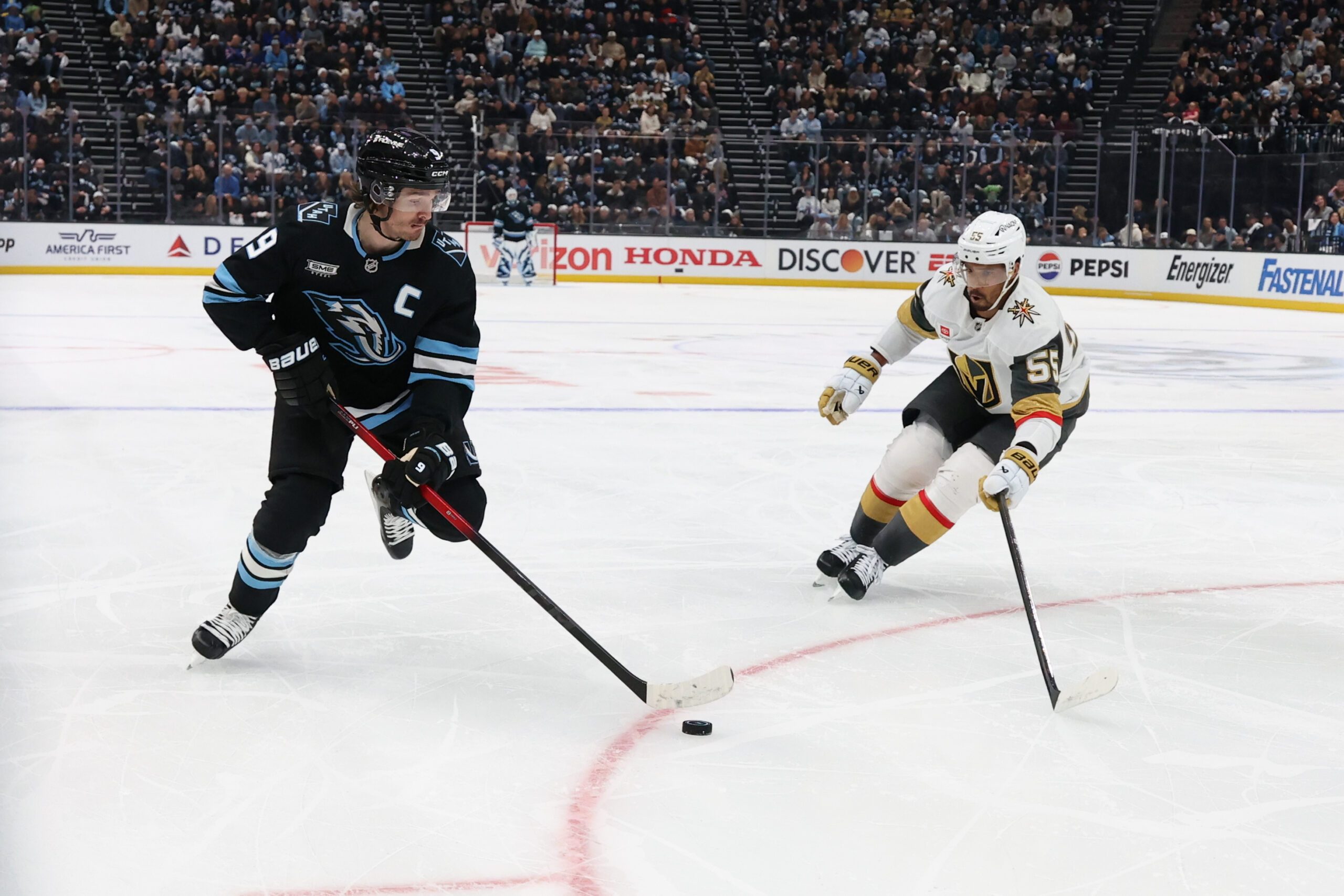 Apr 27, 2026; Salt Lake City, Utah, USA; Utah Mammoth right wing Clayton Keller (9) skates with the puck against Vegas Golden Knights right wing Keegan Kolesar (55) during the first period in game four of the first round of the 2026 Stanley Cup Playoffs at Delta Center. Mandatory Credit: Rob Gray-Imagn Images