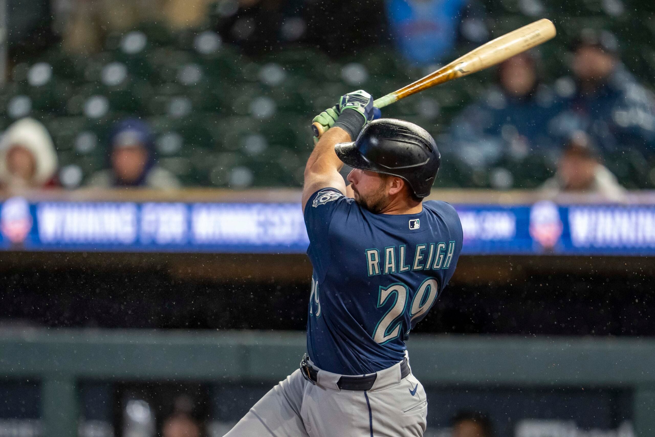 Apr 27, 2026; Minneapolis, Minnesota, USA; Seattle Mariners designated hitter Cal Raleigh (29) hits a two run home run against the Minnesota Twins in the eighth inning at Target Field. Mandatory Credit: Jesse Johnson-Imagn Images