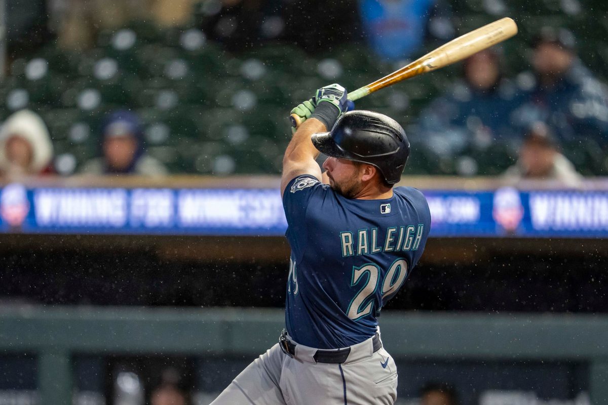Apr 27, 2026; Minneapolis, Minnesota, USA; Seattle Mariners designated hitter Cal Raleigh (29) hits a two run home run against the Minnesota Twins in the eighth inning at Target Field. Mandatory Credit: Jesse Johnson-Imagn Images
