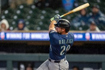 Apr 27, 2026; Minneapolis, Minnesota, USA; Seattle Mariners designated hitter Cal Raleigh (29) hits a two run home run against the Minnesota Twins in the eighth inning at Target Field. Mandatory Credit: Jesse Johnson-Imagn Images