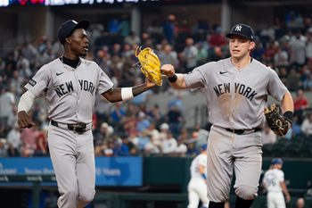 Apr 27, 2026; Arlington, Texas, USA;  New York Yankees second baseman Jazz Chisholm Jr. (13) and first baseman Ben Rice (22) fist bump as they run off the field after the eighth inning against the Texas Rangers at Globe Life Field. Mandatory Credit: Raymond Carlin III-Imagn Images