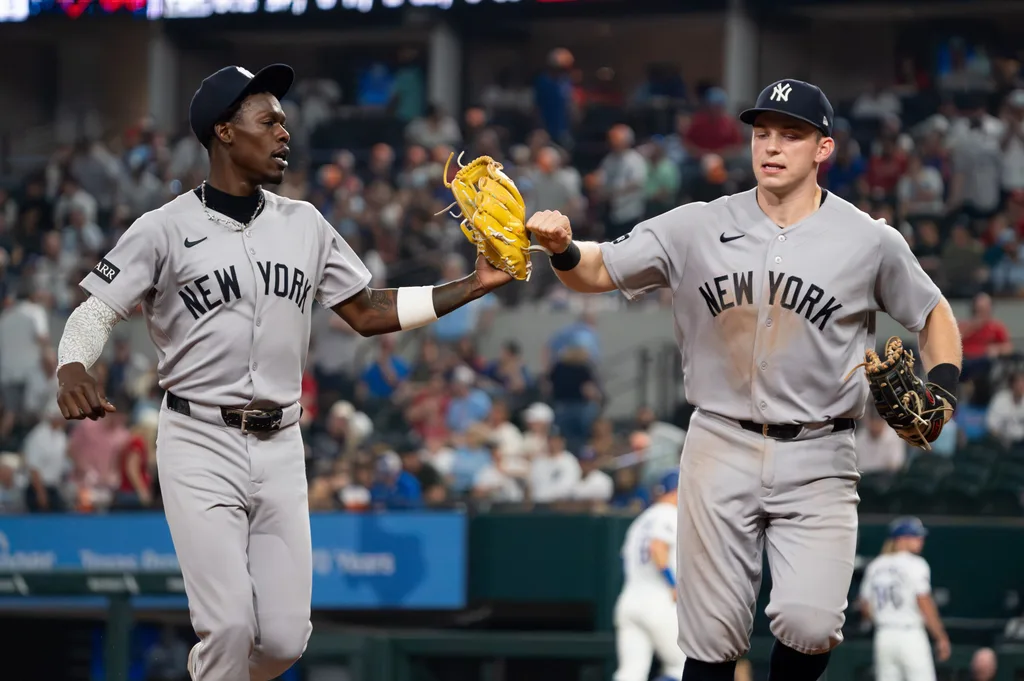 Apr 27, 2026; Arlington, Texas, USA; New York Yankees second baseman Jazz Chisholm Jr. (13) and first baseman Ben Rice (22) fist bump as they run off the field after the eighth inning against the Texas Rangers at Globe Life Field. Mandatory Credit: Raymond Carlin III-Imagn Images