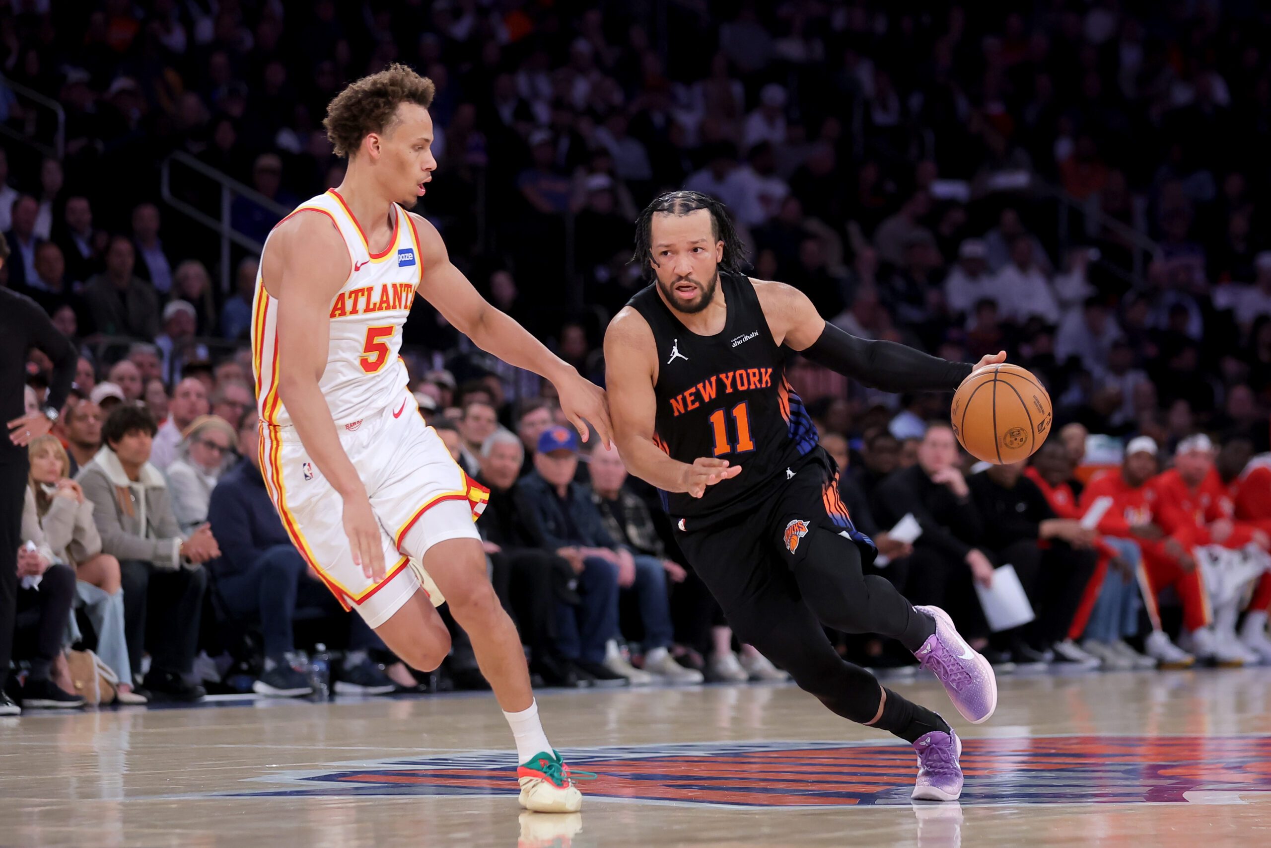 Apr 28, 2026; New York, New York, USA; New York Knicks guard Jalen Brunson (11) brings the ball up court against Atlanta Hawks guard Dyson Daniels (5) during the second quarter of game five of the first round of the 2026 NBA Playoffs at Madison Square Garden. Mandatory Credit: Brad Penner-Imagn Images