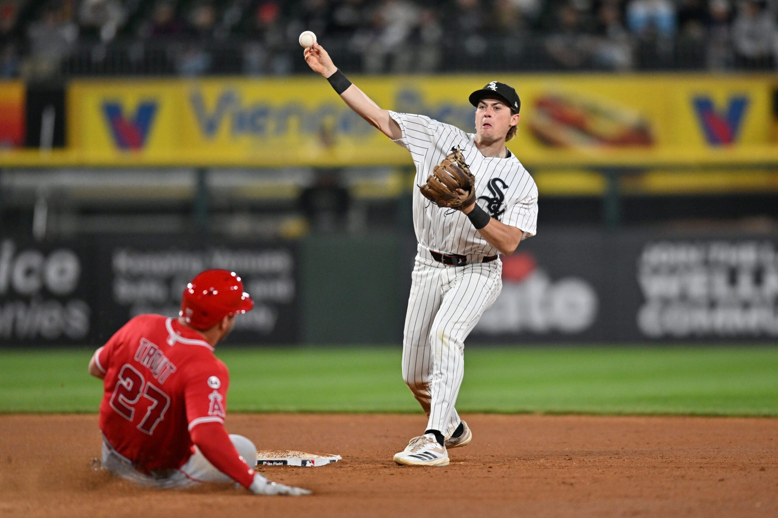 Apr 28, 2026; Chicago, Illinois, USA; Chicago White Sox second baseman Sam Antonacci (17) completes a double play after forcing out Los Angeles Angels center fielder Mike Trout (27) during the ninth inning to end the game at Rate Field. Mandatory Credit: Patrick Gorski-Imagn Images