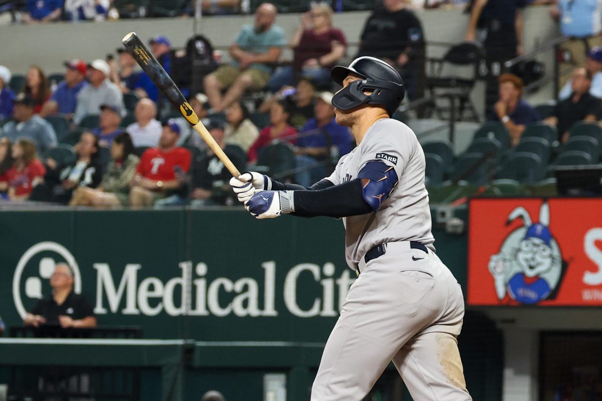 Apr 28, 2026; Arlington, Texas, USA;  New York Yankees right fielder Aaron Judge (99) hits a home run during the ninth inning against the Texas Rangers at Globe Life Field. Mandatory Credit: Kevin Jairaj-Imagn Images