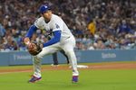 Apr 28, 2026; Los Angeles, California, USA; Los Angeles Dodgers starting pitcher Shohei Ohtani (17) makes a play to throw Miami Marlins center fielder Jakob Marsee (87) out at first base in the fifth inning at Dodger Stadium. Mandatory Credit: Jayne Kamin-Oncea-Imagn Images
