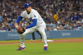 Apr 28, 2026; Los Angeles, California, USA; Los Angeles Dodgers starting pitcher Shohei Ohtani (17) makes a play to throw Miami Marlins center fielder Jakob Marsee (87) out at first base in the fifth inning at Dodger Stadium. Mandatory Credit: Jayne Kamin-Oncea-Imagn Images