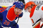 Apr 28, 2026; Edmonton, Alberta, CAN;Edmonton Oilers forward Jack Roslovic (28) and Anaheim Ducks forward Leo Carlsson (91) Gert ready for a face-off during the third period in game five of the first round of the 2026 Stanley Cup Playoffs at Rogers Place. Mandatory Credit: Perry Nelson-Imagn Images