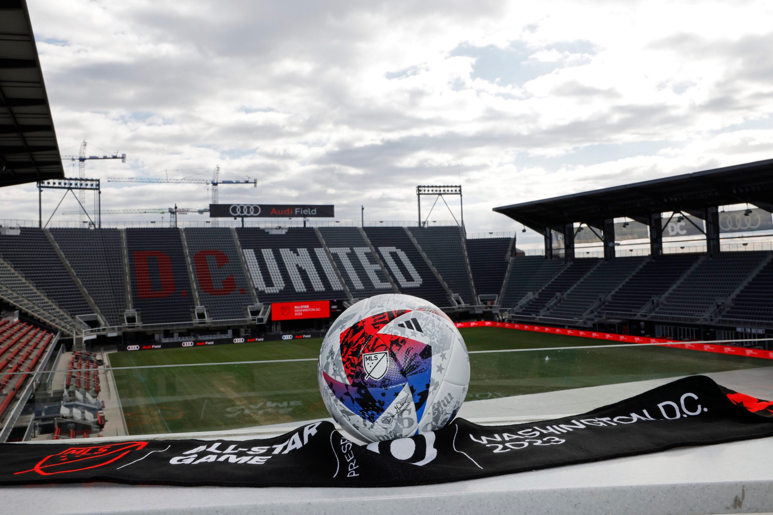 Mar 14, 2023; Washington, DC, USA; A view of an official MLS game ball and an All Star scarf after an announcement that Premier League club Arsenal will play the MLS All Stars at the MLS All-Star Game in Washington D.C at Audi Field. Mandatory Credit: Geoff Burke-Imagn Images