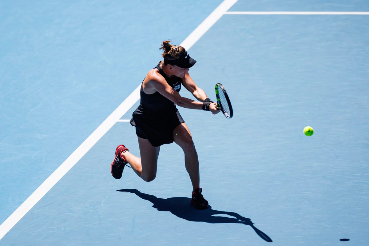 Jan 14, 2024; Melbourne, Victoria, Australia; Sarah Bejlek of the Czech Republic hits a shot against Leylah Fernandez of Canada in the first round of the women s singles. Mandatory Credit: Mike Frey-Imagn Images