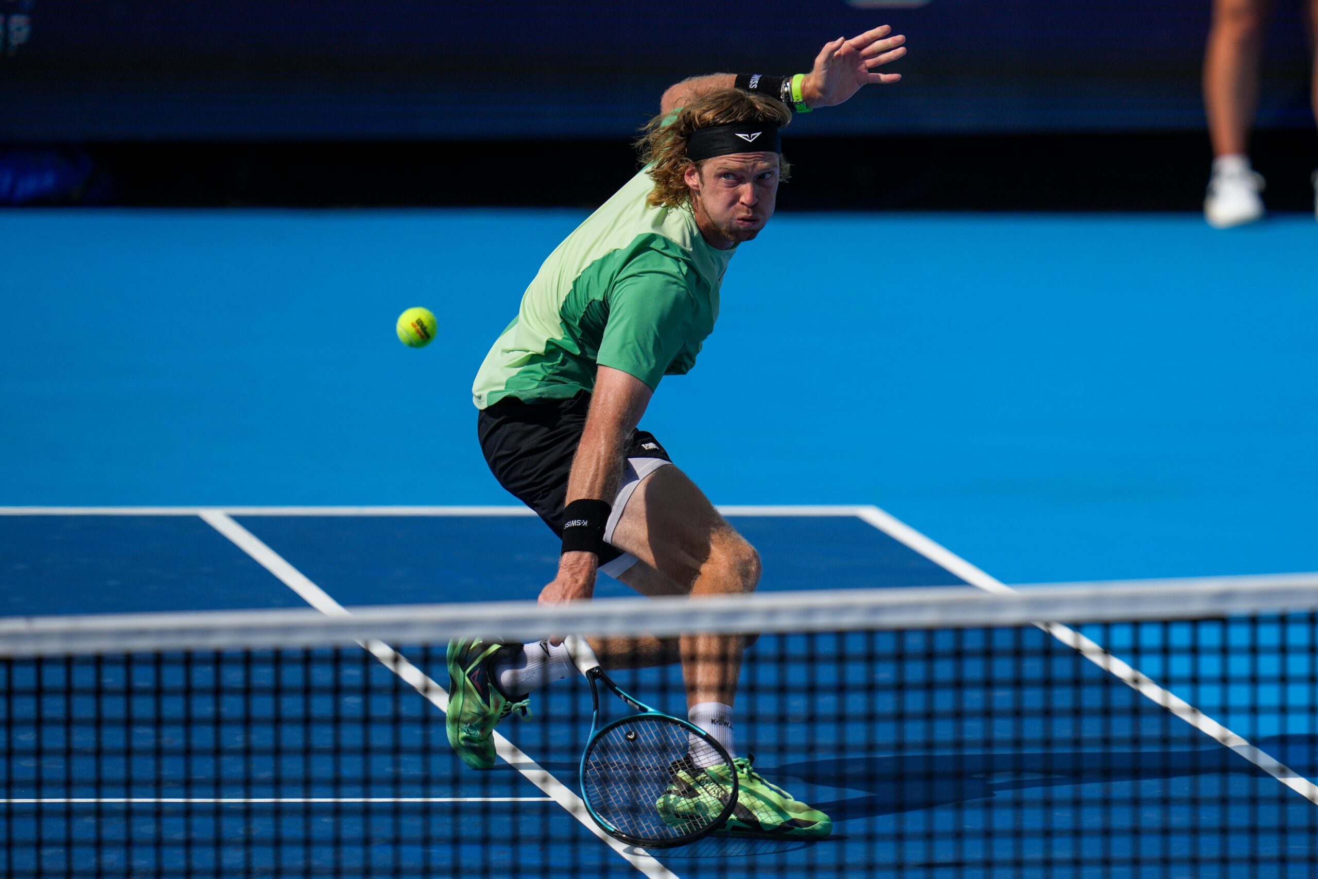 Andrey Rublev returns a shot in the Cincinnati Open quarterfinal match between Andrey Rublev and Carlos Alcaraz at the Lindner Family Tennis Center in Mason, Ohio, on Friday, Aug. 15, 2025. Alcaraz won, 6-3, 4-6, 7-5.