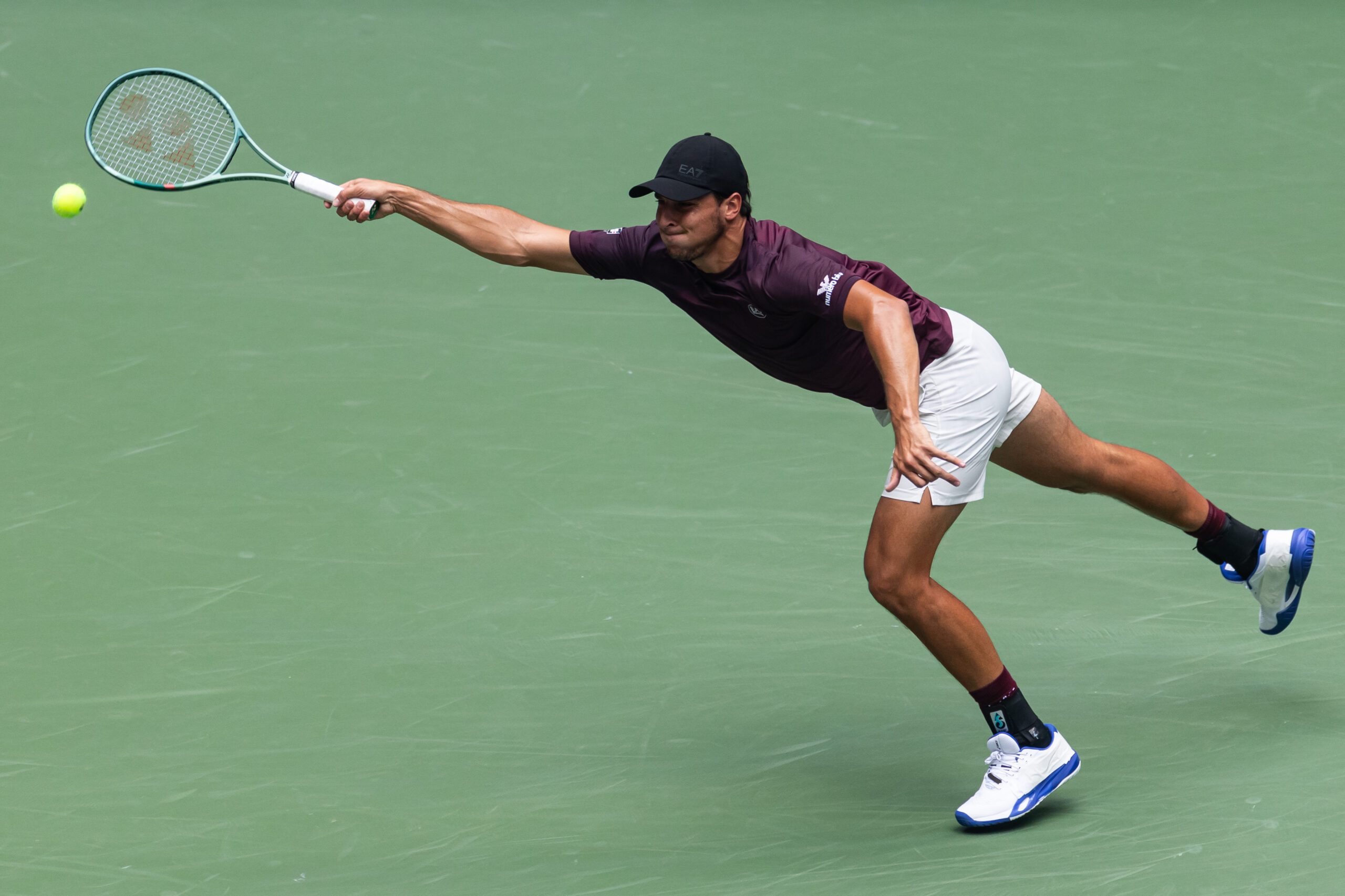 Aug 29, 2025; Flushing, NY, USA; Luciano Darderi of Italy in action against Carlos Alcaraz of Spain in the third round of the menís singles at the US Open at Arthur Ashe Stadium in Billie Jean King National Tennis Center. Mandatory Credit: Mike Frey-Imagn Images