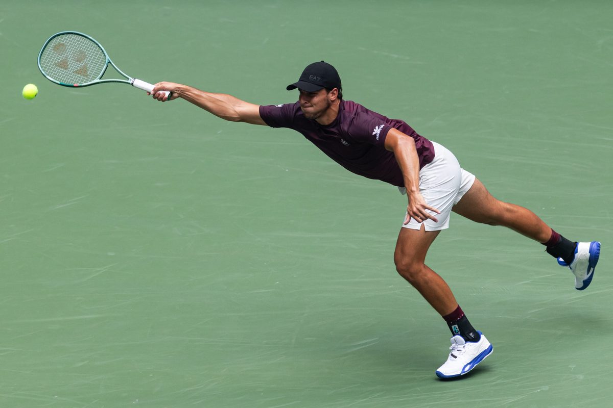 Aug 29, 2025; Flushing, NY, USA; Luciano Darderi of Italy in action against Carlos Alcaraz of Spain in the third round of the menís singles at the US Open at Arthur Ashe Stadium in Billie Jean King National Tennis Center. Mandatory Credit: Mike Frey-Imagn Images