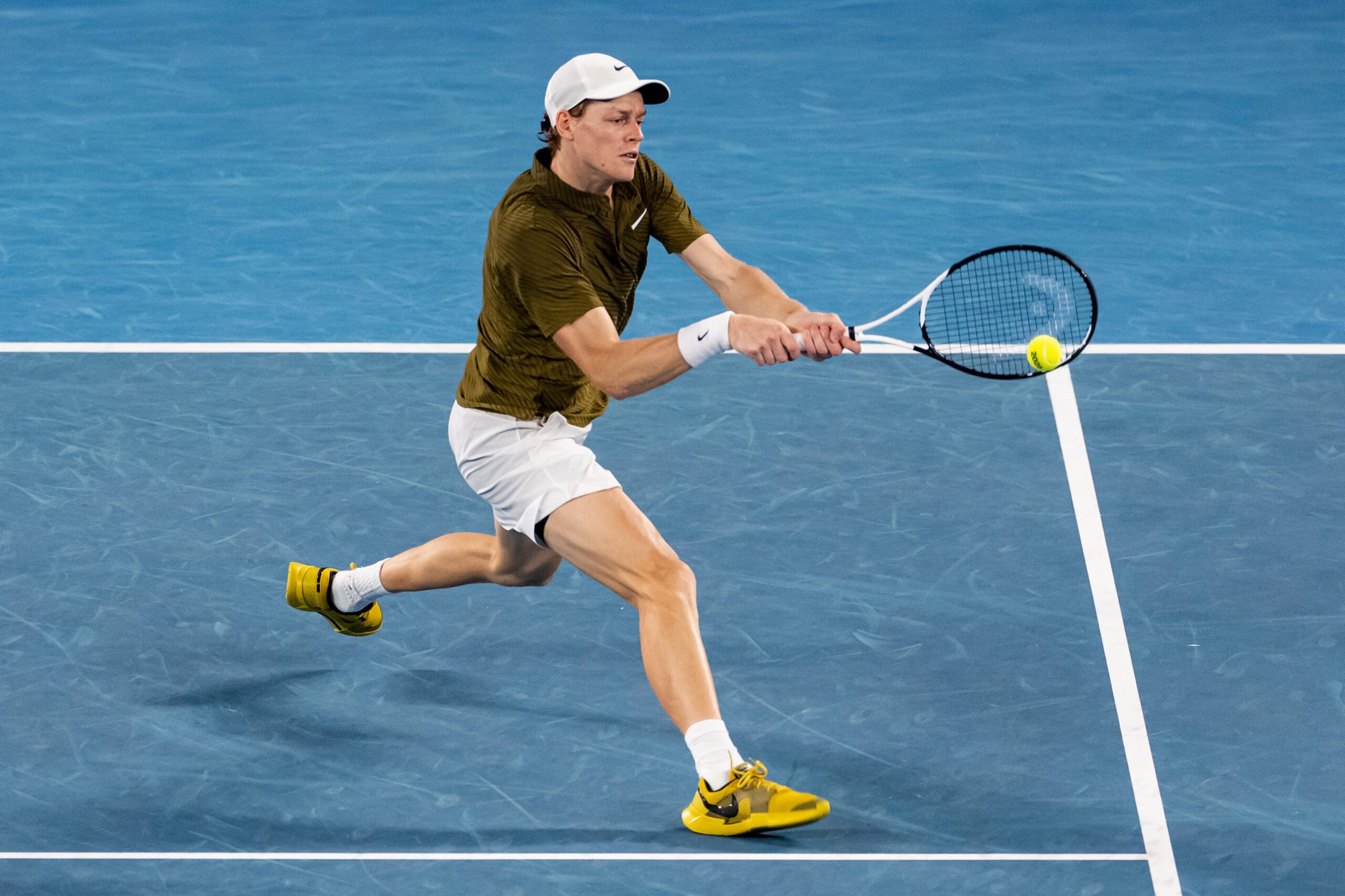 Jan 30, 2026; Melbourne, Victoria, Australia; Jannik Sinner of Italy in action against Novak Djokovic of Serbia in the semifinals of the menís singles at the Australian Open at Rod Laver Arena in Melbourne Park. Mandatory Credit: Mike Frey-Imagn Images