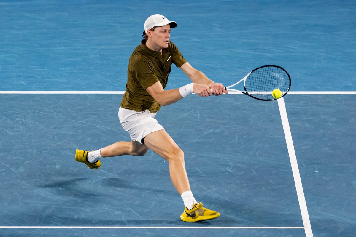 Jan 30, 2026; Melbourne, Victoria, Australia; Jannik Sinner of Italy in action against Novak Djokovic of Serbia in the semifinals of the menís singles at the Australian Open at Rod Laver Arena in Melbourne Park. Mandatory Credit: Mike Frey-Imagn Images