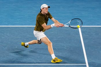 Jan 30, 2026; Melbourne, Victoria, Australia; Jannik Sinner of Italy in action against Novak Djokovic of Serbia in the semifinals of the menís singles at the Australian Open at Rod Laver Arena in Melbourne Park. Mandatory Credit: Mike Frey-Imagn Images