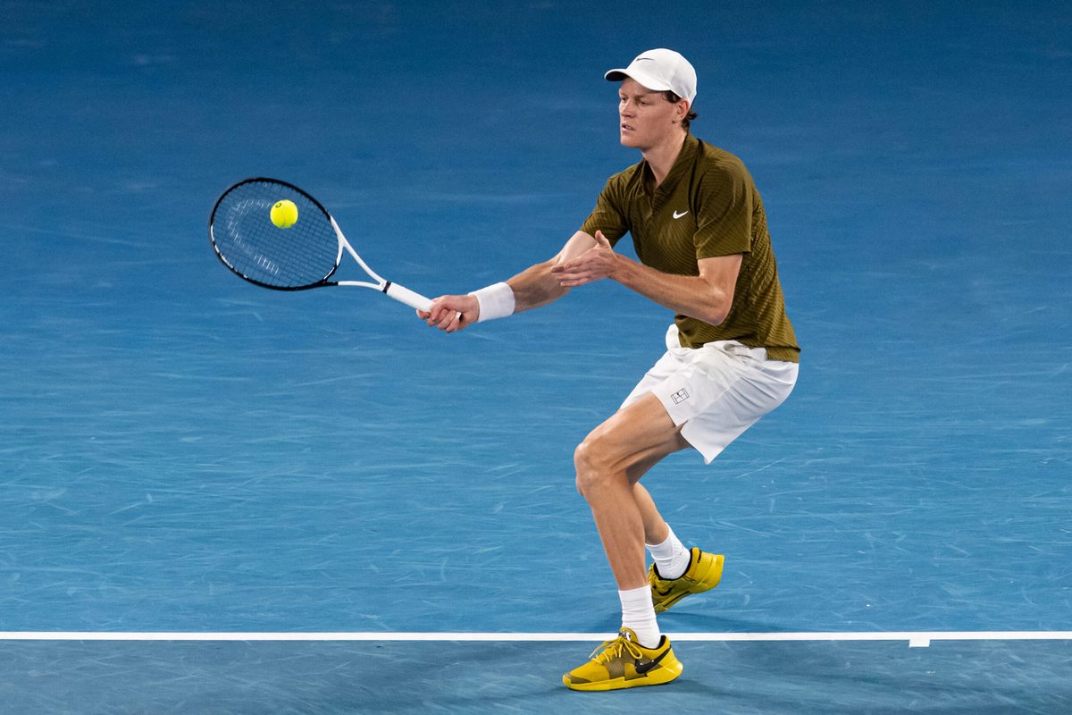 Jan 30, 2026; Melbourne, Victoria, Australia; Jannik Sinner of Italy in action against Novak Djokovic of Serbia in the semifinals of the menís singles at the Australian Open at Rod Laver Arena in Melbourne Park. Mandatory Credit: Mike Frey-Imagn Images