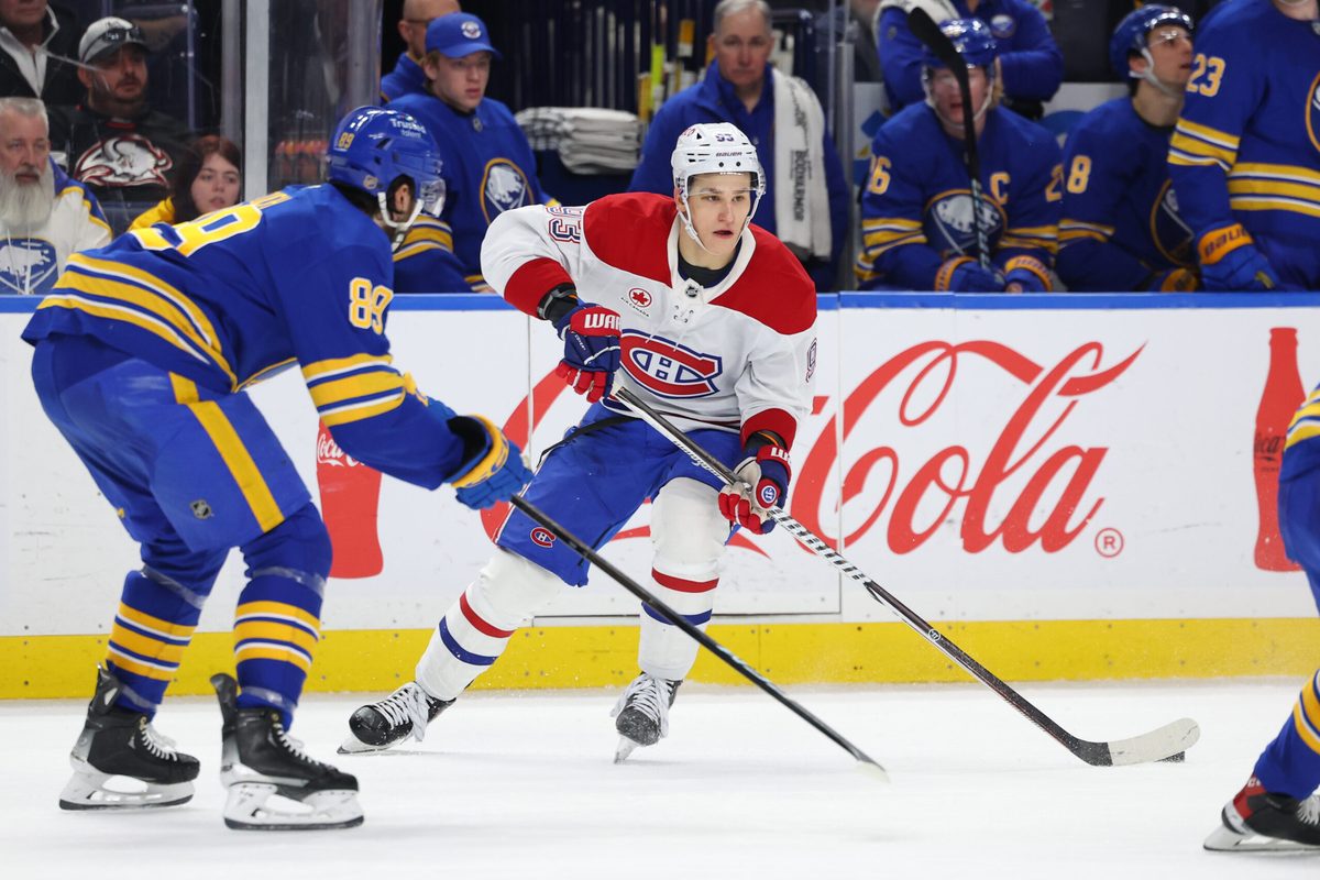 Jan 31, 2026; Buffalo, New York, USA; Montréal Canadiens right wing Ivan Demidov (93) looks to make a pass as Buffalo Sabres right wing Alex Tuch (89) defends during the third period at KeyBank Center. Mandatory Credit: Timothy T. Ludwig-Imagn Images